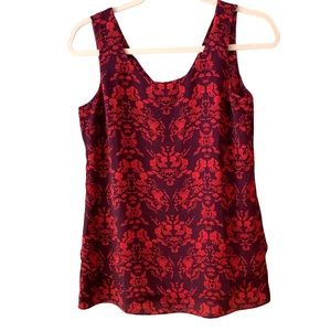 Cabi size XS sleeveless top. Unique red/purple retro cameo patter…